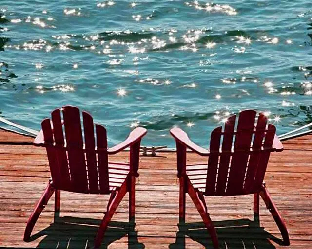 two chairs by the pool
