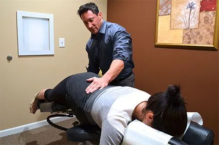 Alpharetta Chiropractor Dr Lubow performing adjustment