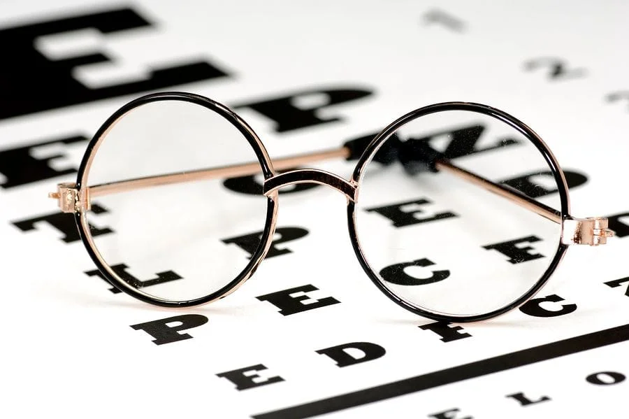 pair of glasses on top of an eye exam chart in Clarksville