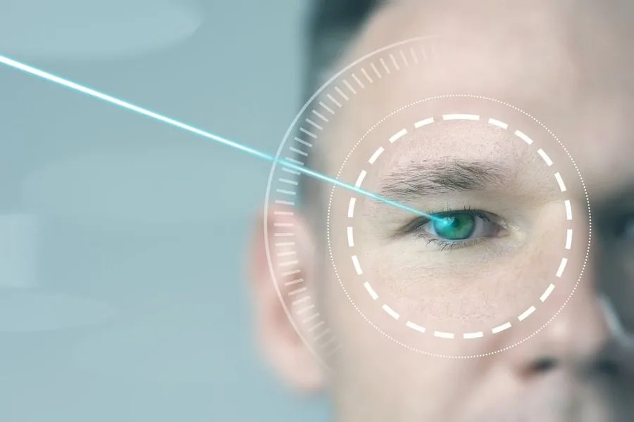 Focused light beam targeting human eye for advanced laser vision correction technology in a clinical setting