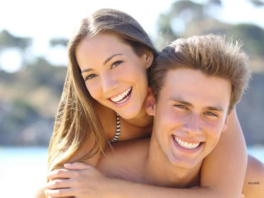 Young couple with beautiful straight teeth