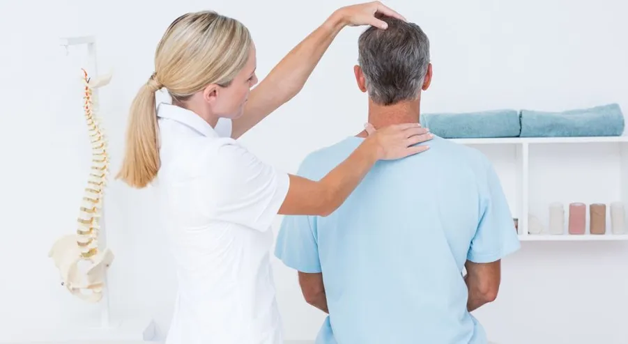 Chiropractor adjusting patient