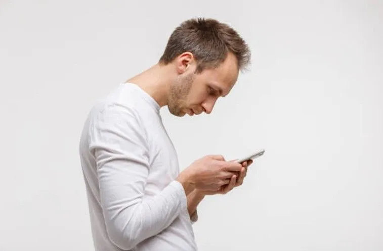 Man Looking at Phone