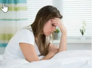 woman experiencing a migrane headache