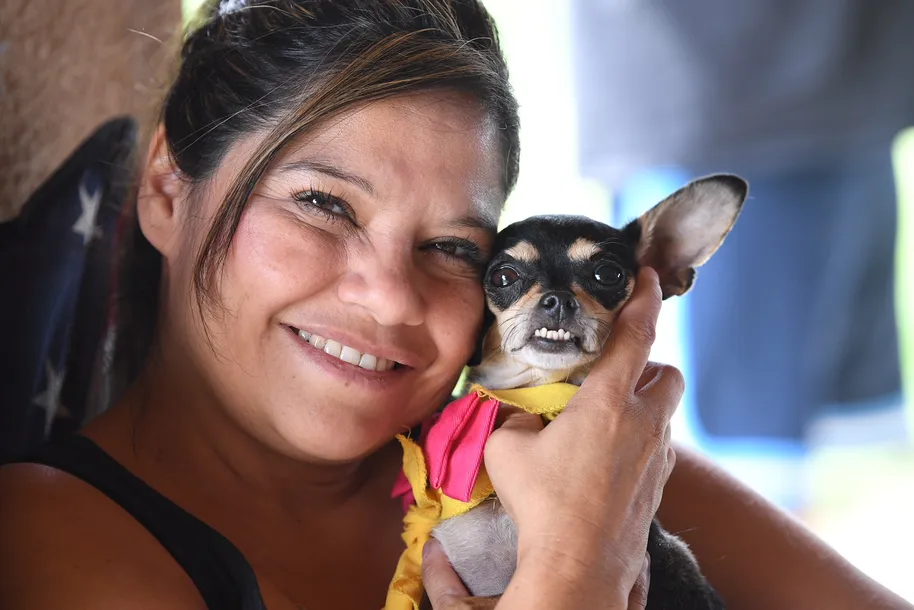 Foster Devona holding dog