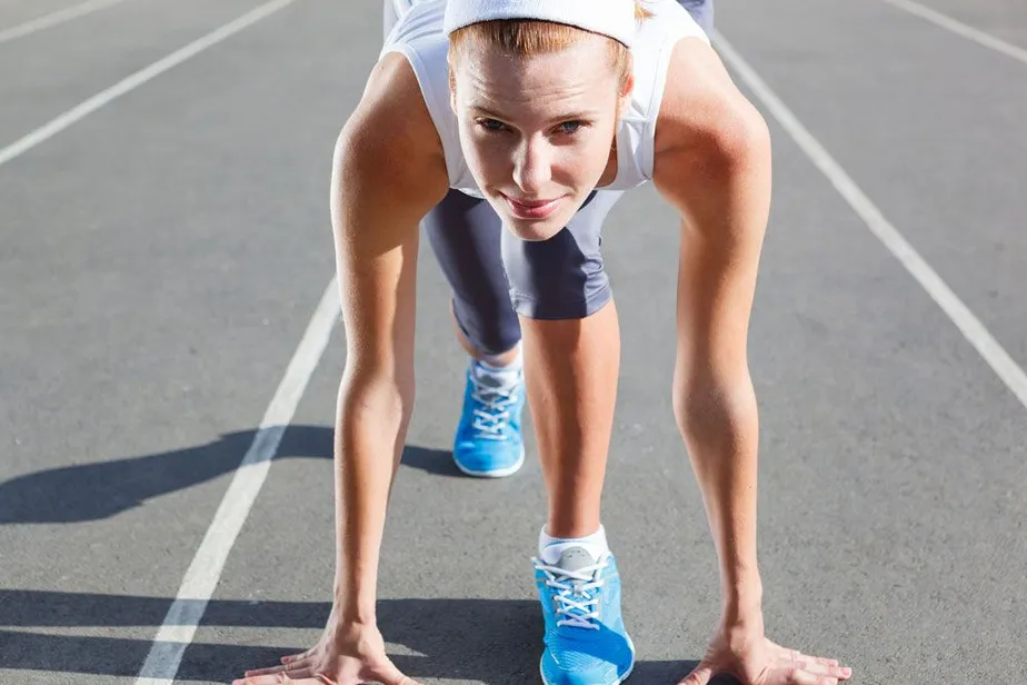 Image of a woman ready to run