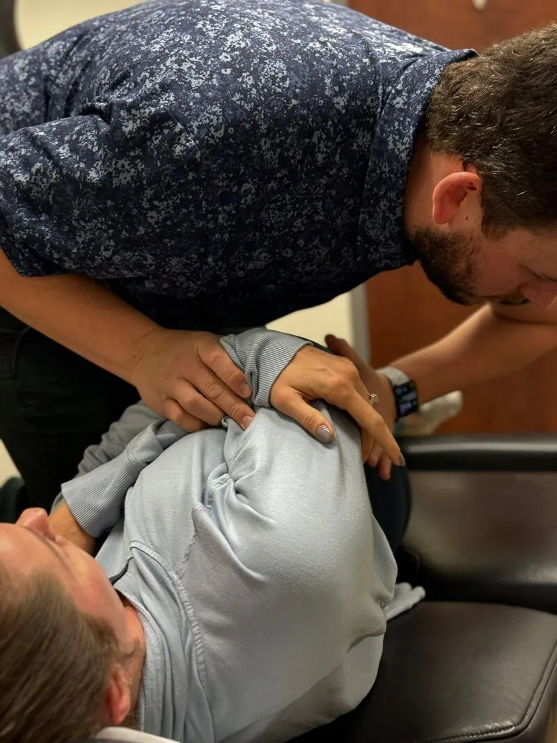 Dr Neill treating patient with spinal manipulation
