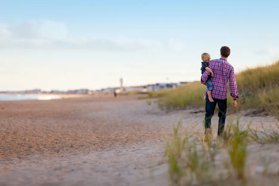 Father and child on beach