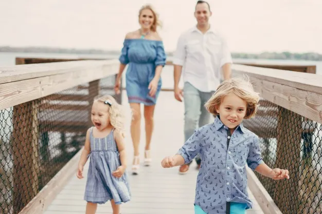 children running happily with family