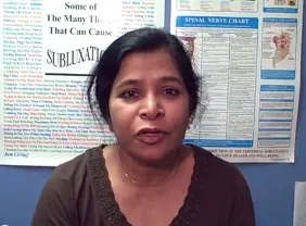 a woman with brown shirt speaking