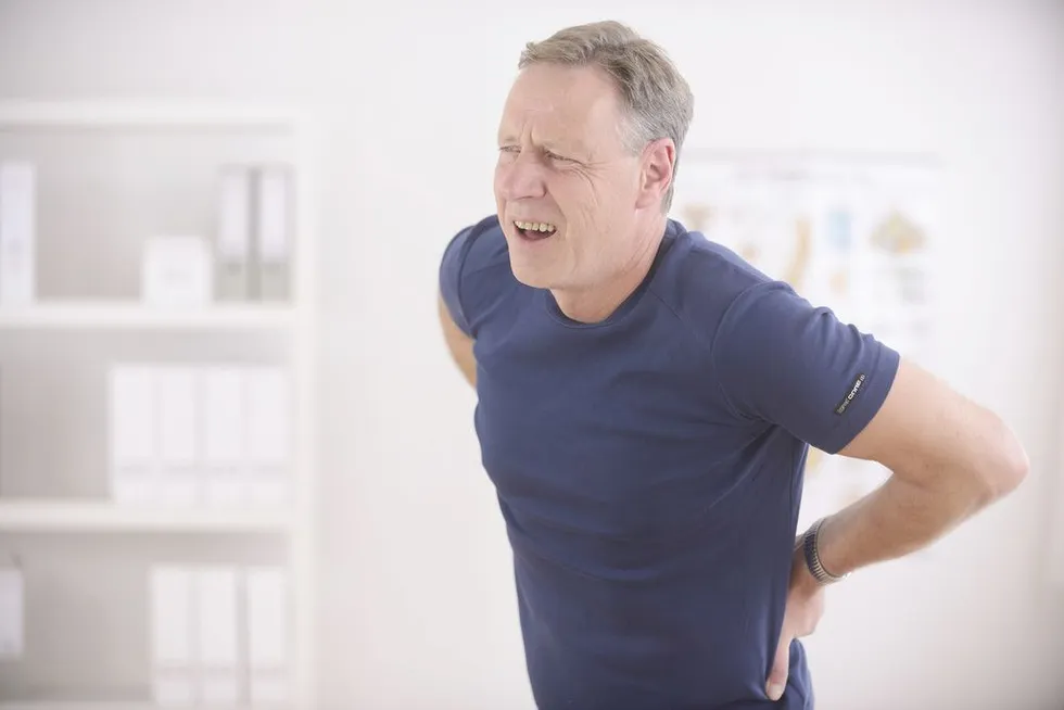 man enduring lower back pain