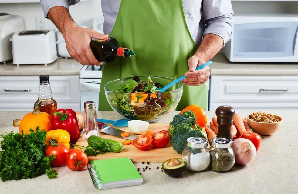 A man making a vegetable salad