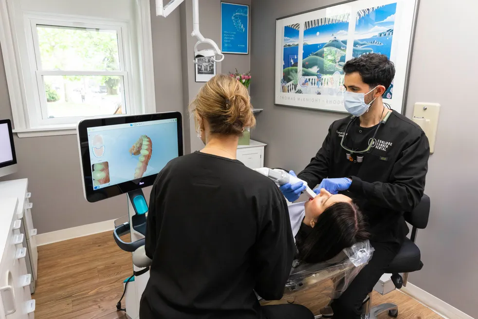 Dr. Sam Ustayev doing Invisalign consultation with patient at Coolidge Corner Dental, Invisalign Brookline, MA dentist