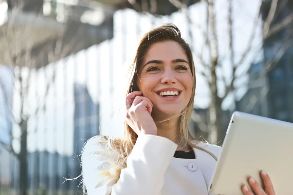 Business woman on phone with tablet