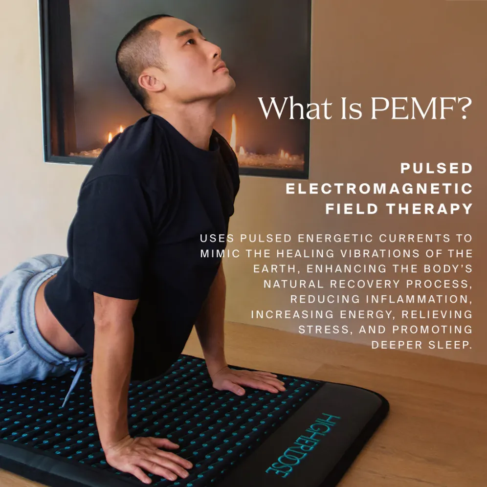asian man in a yoga pose on an Infrared PEMF Pro Mat