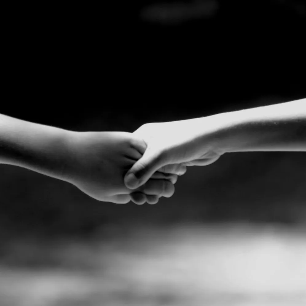 two people holding hands